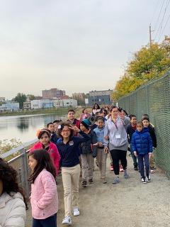 Mrs. Hurtado and a group of students walking on the viaduct pathway
