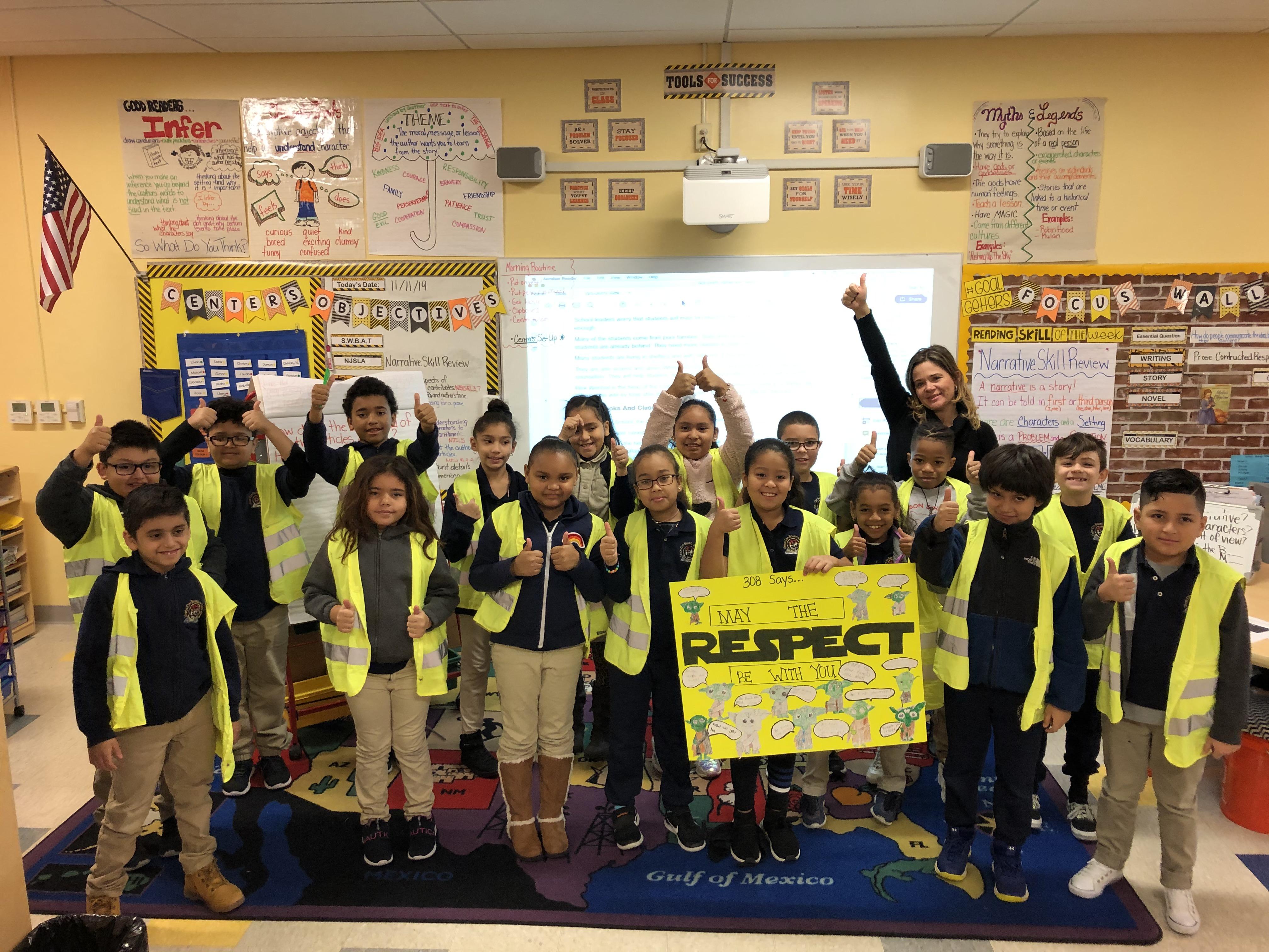 teacher and students wearing reflector smocks how they show respect with thumbs up