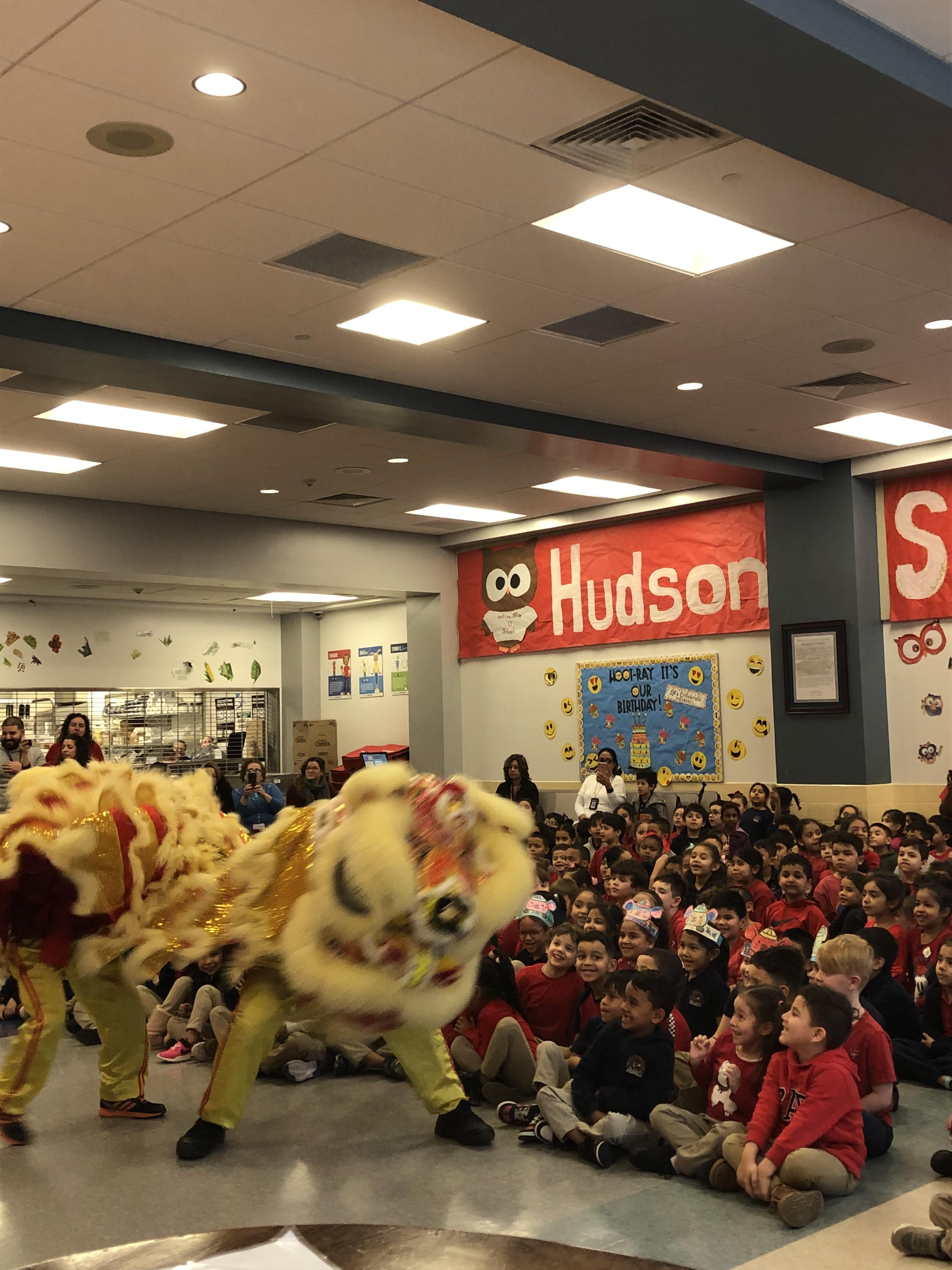dragon dancing in front of students